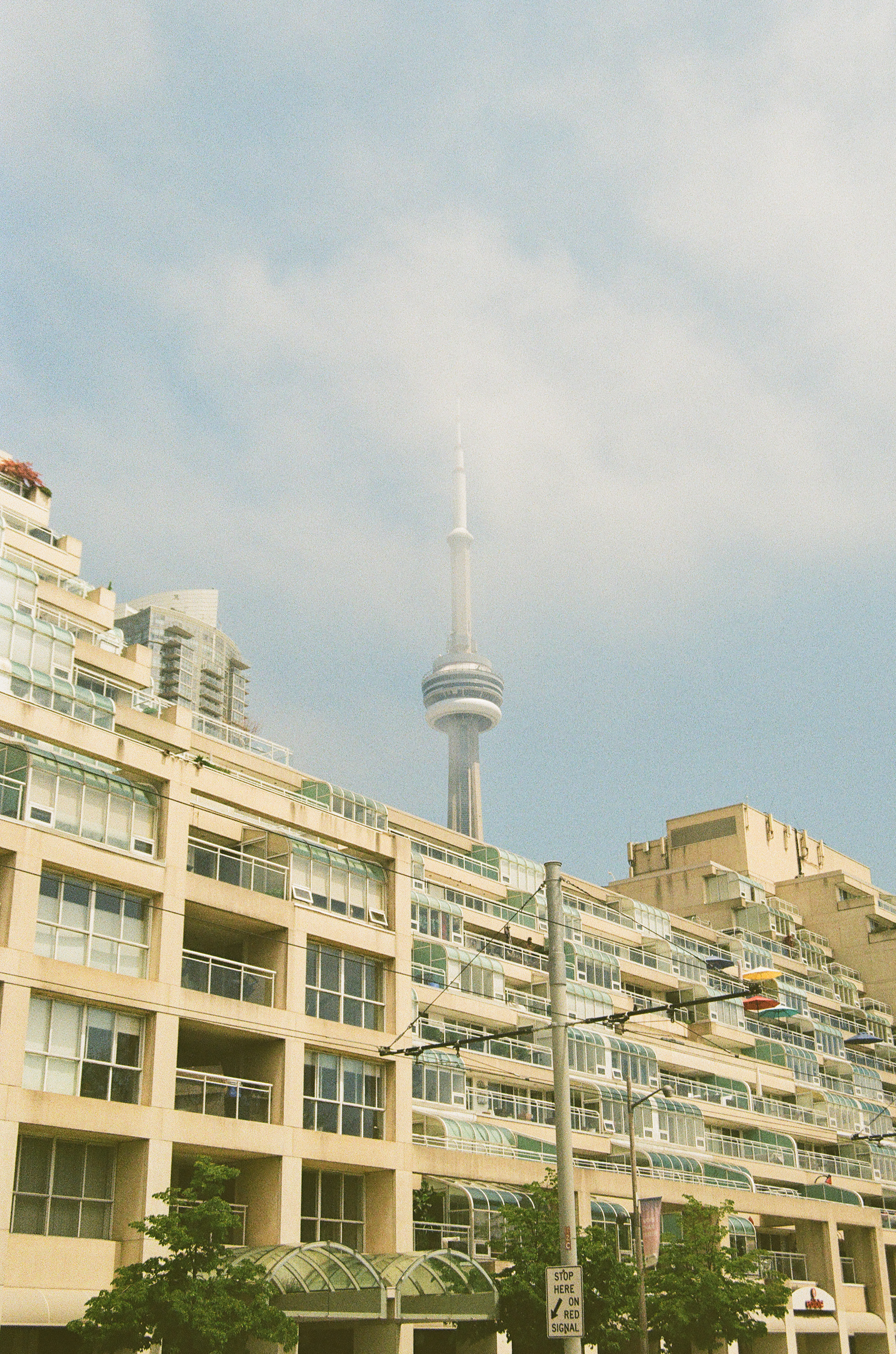 CN Tower through the fog behind the Kings Landing condos